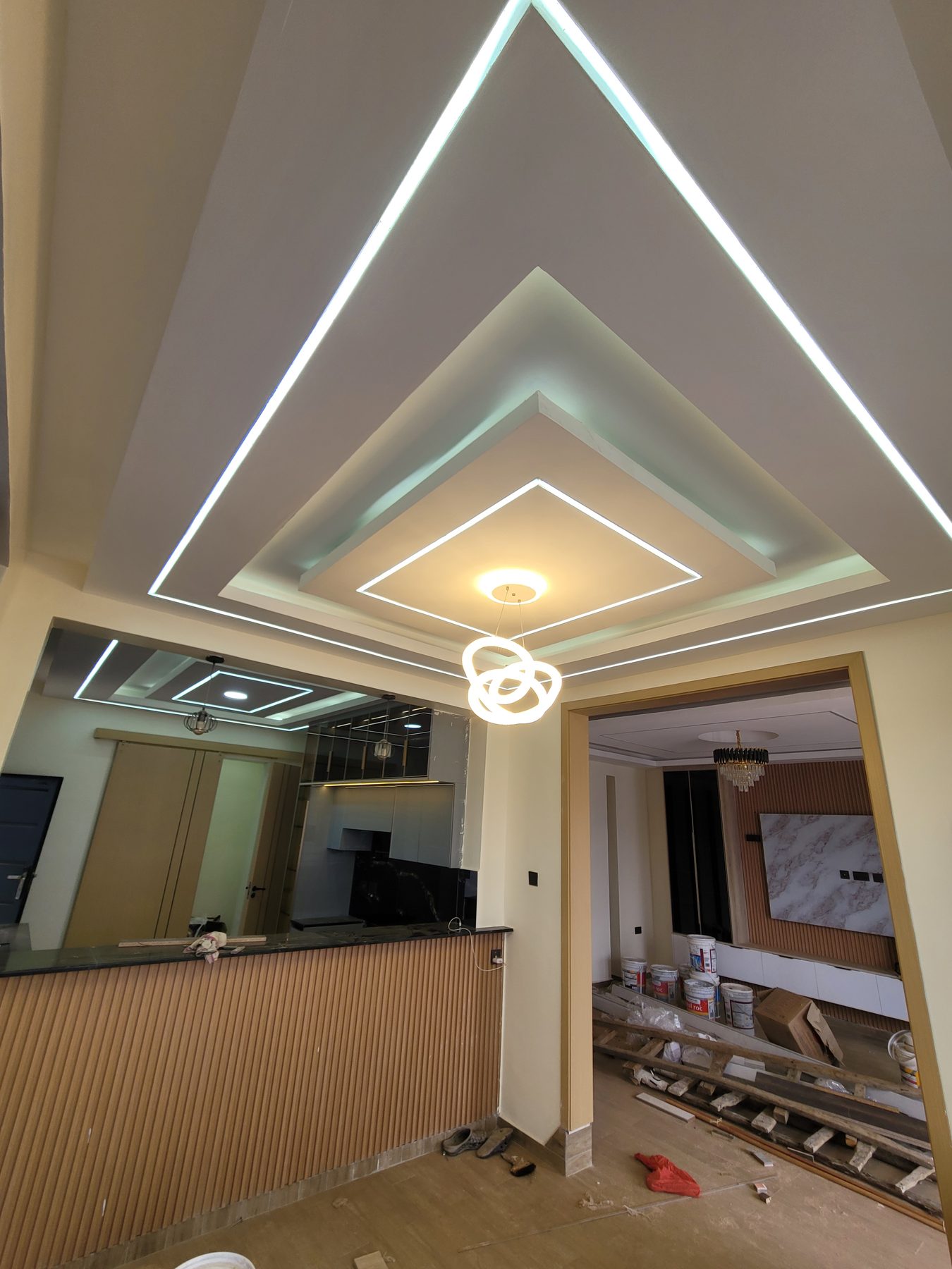 Stepped gypsum tray ceiling with LED cove lighting