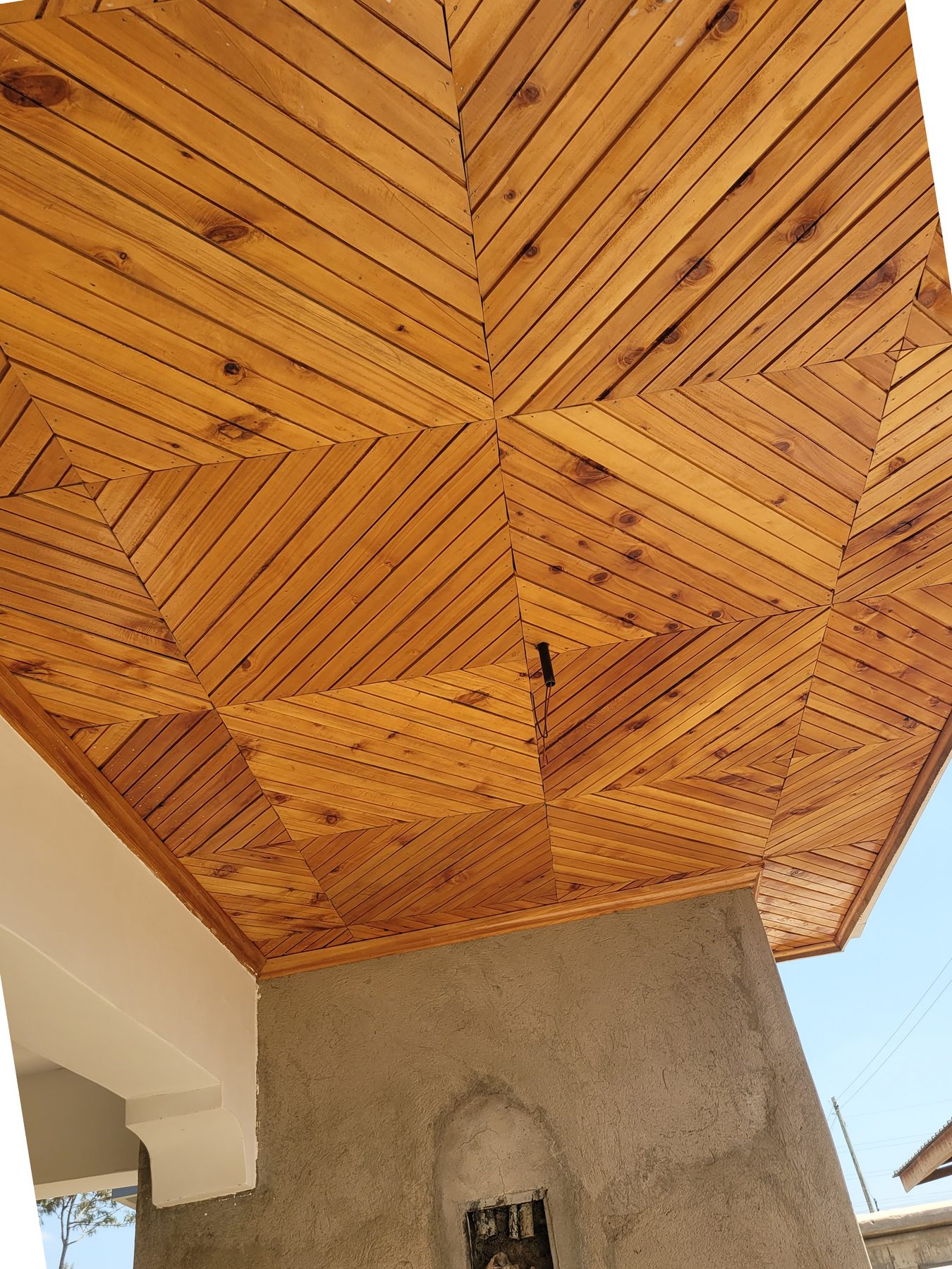 Exterior timber soffit woodwork in a radiating pattern